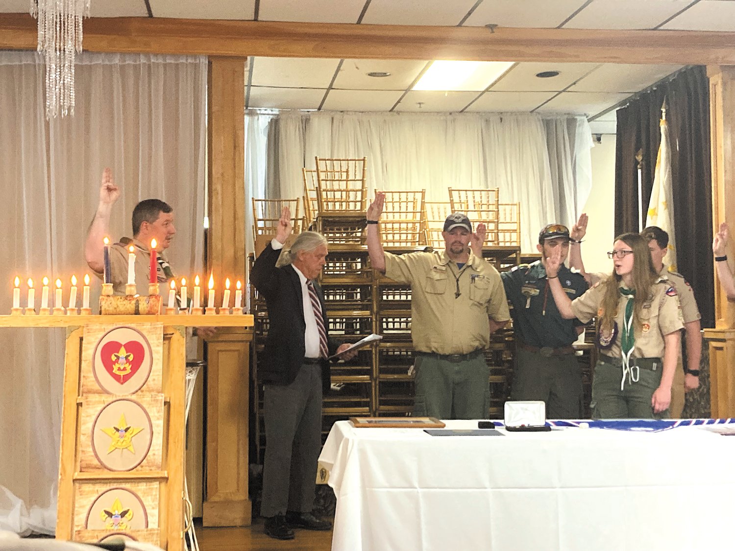LEADING THE SCOUT OATH: Morgan Bitgood led members of Troop 13 and Troop 22 in the scout oath at her Eagle Scout ceremony on June 5.